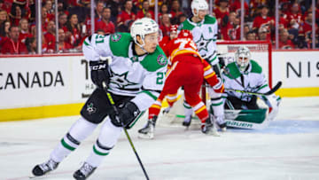 May 11, 2022; Calgary, Alberta, CAN; Dallas Stars left wing Jason Robertson (21) controls the puck against the Calgary Flames during the second period in game five of the first round of the 2022 Stanley Cup Playoffs at Scotiabank Saddledome. Mandatory Credit: Sergei Belski-USA TODAY Sports