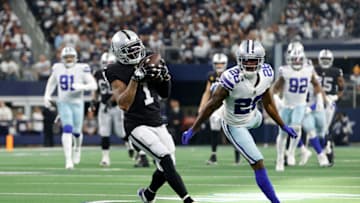 ARLINGTON, TEXAS - NOVEMBER 25: DeSean Jackson #1 of the Las Vegas Raiders makes a reception under pressure from Jourdan Lewis #26 of the Dallas Cowboys prior to scoring his sides first touchdown during the first quarter of the NFL match between Las Vegas Raiders and Dallas Cowboys at AT&T Stadium on November 25, 2021 in Arlington, Texas. (Photo by Tim Nwachukwu/Getty Images)