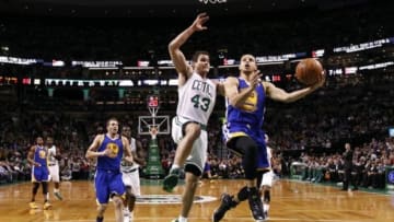 Mar 5, 2014; Boston, MA, USA; Golden State Warriors point guard Stephen Curry (30) shoots the ball against Boston Celtics center Kris Humphries (43) during the first half at TD Garden. Mandatory Credit: Mark L. Baer-USA TODAY Sports