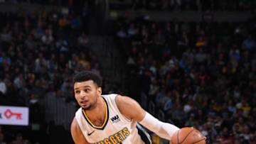 DENVER, CO - DECEMBER 20: Jamal Murray #27 of the Denver Nuggets drives to the basket against the Minnesota Timberwolves on December 20, 2017 at the Pepsi Center in Denver, Colorado. NOTE TO USER: User expressly acknowledges and agrees that, by downloading and/or using this Photograph, user is consenting to the terms and conditions of the Getty Images License Agreement. Mandatory Copyright Notice: Copyright 2017 NBAE (Photo by Bart Young/NBAE via Getty Images)