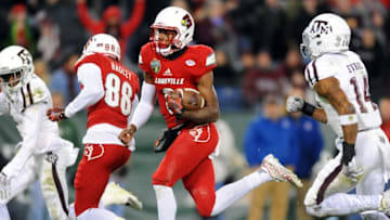 Dec 30, 2015; Nashville, TN, USA; Louisville Cardinals quarterback Lamar Jackson (8) runs for a 62-yard touchdown run during the first half against the Texas A&M Aggies in the 2015 Music City Bowl at Nissan Stadium. Mandatory Credit: Christopher Hanewinckel-USA TODAY Sports