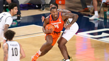 Jan 20, 2021; Atlanta, Georgia, USA; Clemson Tigers forward Aamir Simms (25) drives to the basket against the Georgia Tech Yellow Jackets in the second half at McCamish Pavilion. Mandatory Credit: Brett Davis-USA TODAY Sports