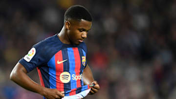 Barcelona's Spanish forward Ansu Fati grabs his jersey during the Spanish league football match between FC Barcelona and Girona FC at the Camp Nou stadium in Barcelona on April 10, 2023. (Photo by Pau BARRENA / AFP) (Photo by PAU BARRENA/AFP via Getty Images)