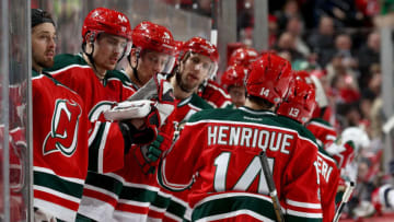 NEWARK, NJ - JANUARY 26: Adam Henrique #14 of the New Jersey Devils is congratulated by teammates on the bench after he scored a goal in the second period against the Washington Capitals on January 26, 2017 at Prudential Center in Newark, New Jersey. (Photo by Elsa/Getty Images)