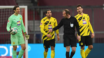 Borussia Dortmund players weren't happy with the referee's decision (Photo by ANDREAS GEBERT/POOL/AFP via Getty Images)