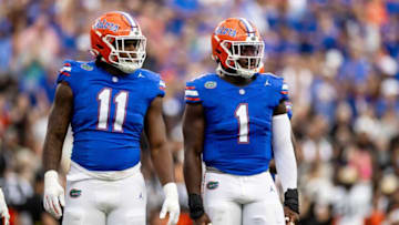 Florida Gators defensive end Kelby Collins (11) and Florida Gators defensive end Princely Umanmielen (1) wait for a play call during the first half against the Vanderbilt Commodores at Steve Spurrier Field at Ben Hill Griffin Stadium in Gainesville, FL on Saturday, October 7, 2023. [Matt Pendleton/Gainesville Sun]