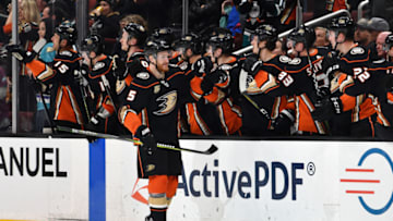 ANAHEIM, CA - APRIL 05: Anaheim Ducks defenseman Korbinian Holzer (5) is greeted by his teammates after Holzer scored a goal during the second period of a game against the Los Angeles Kings played on April 5, 2019 at the Honda Center in Anaheim, CA. (Photo by John Cordes/Icon Sportswire via Getty Images)