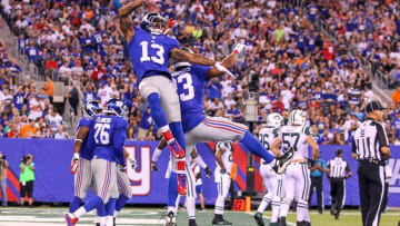 Aug 29, 2015; East Rutherford, NJ, USA; New York Giants wide receiver Odell Beckham Jr. (13) and New York Giants running back Rashad Jennings (23) celebrate Jennings