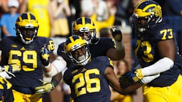 Oct 10, 2015; Ann Arbor, MI, USA; Michigan Wolverines cornerback Jourdan Lewis (26) celebrates with teammates after he scores a touchdown on an interception in the second quarter against the Northwestern Wildcats at Michigan Stadium. Mandatory Credit: Rick Osentoski-USA TODAY Sports