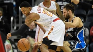 Feb 8, 2016; Atlanta, GA, USA; Atlanta Hawks forward Kent Bazemore (24) collides with Orlando Magic guard Evan Fournier (10) during the first half at Philips Arena. Mandatory Credit: Dale Zanine-USA TODAY Sports