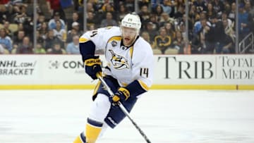 Mar 31, 2016; Pittsburgh, PA, USA; Nashville Predators defenseman Mattias Ekholm (14) chases the puck up ice against the Pittsburgh Penguins during the first period at the CONSOL Energy Center. Mandatory Credit: Charles LeClaire-USA TODAY Sports