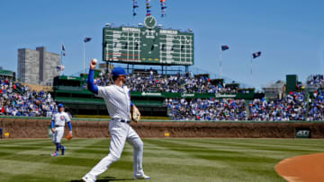 CHICAGO, IL - APRIL 28: Kris Bryant #17 of the Chicago Cubs warms up before the game against the Milwaukee Brewers, in his first start since being hit by a pitch severeal days ago, at Wrigley Field on April 28, 2018 in Chicago, Illinois. (Photo by Jon Durr/Getty Images)