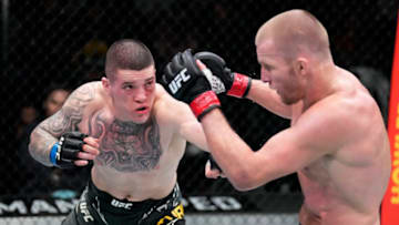 LAS VEGAS, NEVADA - FEBRUARY 26: (L-R) Wellington Turman of Brazil punches Misha Cirkunov of Latvia in their middleweight fight during the UFC Fight Night event at UFC APEX on February 26, 2022 in Las Vegas, Nevada. (Photo by Chris Unger/Zuffa LLC)