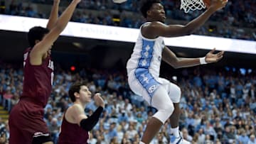 CHAPEL HILL, NORTH CAROLINA - JANUARY 02: Nassir Little #5 of the North Carolina Tar Heels drives against Noah Kirkwood #10 of the Harvard Crimson during the second half at the Dean Smith Center on January 02, 2019 in Chapel Hill, North Carolina. North Carolina won 77-57. (Photo by Grant Halverson/Getty Images)