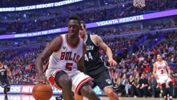 Dec 21, 2015; Chicago, IL, USA; Chicago Bulls forward Bobby Portis (5) chases the ball with Brooklyn Nets guard Bojan Bogdanovic (44) during the second quarter at the United Center. Mandatory Credit: Dennis Wierzbicki-USA TODAY Sports