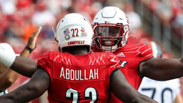 Yasir Abdullah is congratulated by YaYa Diaby after sacking the quarterback in the first half.Cardscavs02