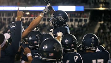 Sep 2, 2016; Reno, NV, USA; Nevada Reno running back James Butler (20) is lifted onto his teammates shoulders after his five yard OT touchdown run that gave the wolf pack a 30-27 win over the Cal Poly Mustangs at MacKay Stadium. Mandatory Credit: Lance Iversen-USA TODAY Sports