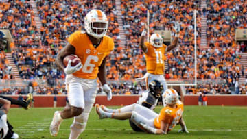 Nov 19, 2016; Knoxville, TN, USA; Tennessee Volunteers quarterback Joshua Dobbs (11) signals a touchdown as Tennessee Volunteers running back Alvin Kamara (6) scores against the Missouri Tigers during the second quarter at Neyland Stadium. Mandatory Credit: Randy Sartin-USA TODAY Sports