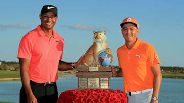 NASSAU, BAHAMAS - DECEMBER 03: Rickie Fowler of the United States poses with tournament host Tiger Woods after winning the Hero World Challenge at Albany, Bahamas on December 3, 2017 in Nassau, Bahamas. (Photo by Mike Ehrmann/Getty Images)