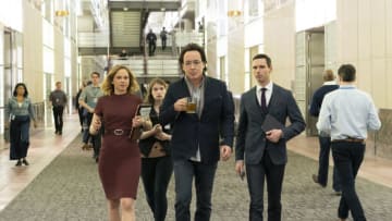 John Cusack (center holding glass) and Cory Michael Smith (right wearing tie) in Utopia - Courtesy of Elizabeth Morris / Amazon Studios