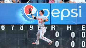 Jul 20, 2016; Bronx, NY, USA; Baltimore Orioles right fielder Joey Rickard (23) drops a fly ball by New York Yankees left fielder Brett Gardner (not pictured) for a leadoff triple during the first inning at Yankee Stadium. Mandatory Credit: Brad Penner-USA TODAY Sports
