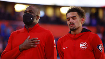 ORLANDO, FLORIDA - DECEMBER 15: Head coach Nate McMillan and Trae Young #11 of the Atlanta Hawks look on prior to the game against the Orlando Magic at Amway Center on December 15, 2021 in Orlando, Florida. NOTE TO USER: User expressly acknowledges and agrees that, by downloading and or using this photograph, User is consenting to the terms and conditions of the Getty Images License Agreement. (Photo by Michael Reaves/Getty Images)
