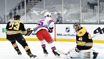 Mar 11, 2021; Boston, Massachusetts, USA; Boston Bruins goaltender Jaroslav Halak (41) makes a save on New York Rangers defenseman Ryan Lindgren (55) while defenseman Charlie McAvoy (73) during the second period at TD Garden. Mandatory Credit: Bob DeChiara-USA TODAY Sports