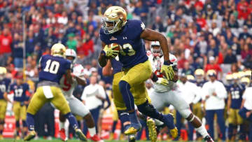 Jan 1, 2016; Glendale, AZ, USA; Notre Dame Fighting Irish running back Josh Adams (33) against the Ohio State Buckeyes during the 2016 Fiesta Bowl at University of Phoenix Stadium. Mandatory Credit: Mark J. Rebilas-USA TODAY Sports