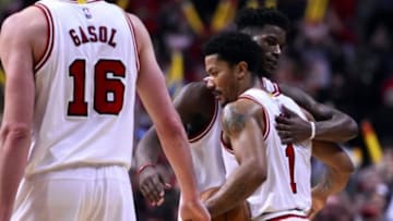 Apr 20, 2015; Chicago, IL, USA; Chicago Bulls guard Derrick Rose (1) and Chicago Bulls guard Jimmy Butler (21) react after the game against the Milwaukee Bucks in game two of the first round of the 2015 NBA Playoffs at the United Center. The Chicago Bulls defeat the Milwaukee Bucks 92-81. Mandatory Credit: Mike DiNovo-USA TODAY Sports