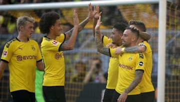 Dortmund's German forward Marco Reus (R) celebrates scoring the 2-0 during the German first division Bundesliga football match BVB Borussia Dortmund v Bayer 04 Leverkusen in Dortmund, western Germany on September 14, 2019. (Photo by Hasan BRATIC / AFP) / RESTRICTIONS: DFL REGULATIONS PROHIBIT ANY USE OF PHOTOGRAPHS AS IMAGE SEQUENCES AND/OR QUASI-VIDEO (Photo credit should read HASAN BRATIC/AFP/Getty Images)