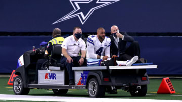 ARLINGTON, TEXAS - OCTOBER 11: Dak Prescott #4 of the Dallas Cowboys is carted off the field after sustaining a leg injury against the New York Giants during the third quarter at AT&T Stadium on October 11, 2020 in Arlington, Texas. (Photo by Tom Pennington/Getty Images)