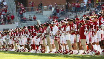 Nov 7, 2020; Norman, Oklahoma, USA; Oklahoma Sooners players form a line to symbolize unity before the game against the Kansas Jayhawks at Gaylord Family-Oklahoma Memorial Stadium. Mandatory Credit: Kevin Jairaj-USA TODAY Sports