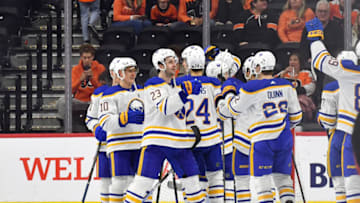 Apr 1, 2023; Philadelphia, Pennsylvania, USA; Buffalo Sabres defenseman Mattias Samuelsson (23) and right wing Jack Quinn (22) celebrate win against the Philadelphia Flyers at Wells Fargo Center. Mandatory Credit: Eric Hartline-USA TODAY Sports