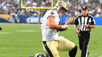 CARSON, CA - AUGUST 25: Taysom Hill #7 of the New Orleans Saints gets past Rayshawn Jenkins #25 of the Los Angeles Chargers as he runs into the end zone for a touchdown in the third quarter of the preseason game at StubHub Center on August 25, 2018 in Carson, California. (Photo by Jayne Kamin-Oncea/Getty Images)