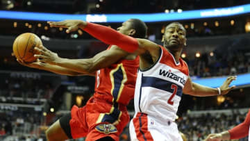 Feb 23, 2016; Washington, DC, USA; Washington Wizards guard John Wall (2) fouls New Orleans Pelicans guard Toney Douglas (16) during the first half at Verizon Center. Mandatory Credit: Brad Mills-USA TODAY Sports