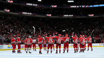RALEIGH, NORTH CAROLINA - DECEMBER 15: The Carolina Hurricanes celebrate with a Storm Surge after their win against the Seattle Kraken at PNC Arena on December 15, 2022 in Raleigh, North Carolina. The Hurricanes win 3-2. (Photo by Grant Halverson/Getty Images)