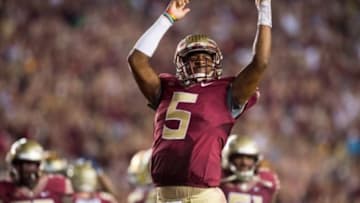Oct 18, 2014; Tallahassee, FL, USA; Florida State Seminoles quarterback Jameis Winston (5) celebrates after defeating the Notre Dame Fighting Irish 31-27 at Doak Campbell Stadium. Mandatory Credit: Matt Cashore-USA TODAY Sports