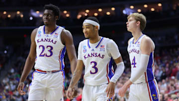 DES MOINES, IOWA - MARCH 18: Ernest Udeh Jr. #23, Dajuan Harris Jr. #3, and Gradey Dick #4 of the Kansas Jayhawks react during a stoppage in play against the Arkansas Razorbacks during the second half in the second round of the NCAA Men's Basketball Tournament at Wells Fargo Arena on March 18, 2023 in Des Moines, Iowa. (Photo by Michael Reaves/Getty Images)