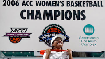 Mar 5, 2006; Greensboro, NC, USA; North Carolina Tar Heels (12) Ivory Latta does chin ups on the rim to celebrate after the Tar Heels 91-80 victory over the Maryland Terrapins in the ACC Women's Championship at the Greensboro Coliseum. Mandatory Credit: Bob Donnan-USA TODAY Sports Copyright © 2006 Bob Donnan