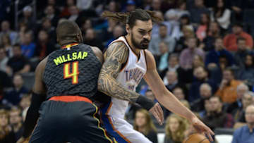 Dec 19, 2016; Oklahoma City, OK, USA; Oklahoma City Thunder center Steven Adams (12) spins around Atlanta Hawks forward Paul Millsap (4) during the first quarter at Chesapeake Energy Arena. Mandatory Credit: Mark D. Smith-USA TODAY Sports