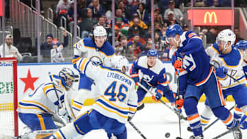 Mar 25, 2023; Elmont, New York, USA; New York Islanders right wing Hudson Fasching (20) attempts a shot on goal in the second period against the Buffalo Sabres at UBS Arena. Mandatory Credit: Wendell Cruz-USA TODAY Sports
