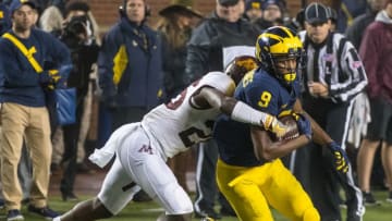 ANN ARBOR, MI - NOVEMBER 04: Donovan Peoples-Jones #9 of the Michigan Wolverines tries to run break the tackle of Justus Harris #26 of the Minnesota Golden Gophers during a college football game at Michigan Stadium on November 4, 2017 in Ann Arbor, Michigan. The Wolverines defeated the Golden Gophers 33-10. (Photo by Dave Reginek/Getty Images)