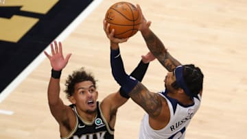 Trae Young of the Atlanta Hawks defends against D'Angelo Russell of the Minnesota Timberwolves. (Photo by Kevin C. Cox/Getty Images)
