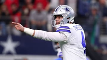 ARLINGTON, TEXAS - DECEMBER 23: Dak Prescott #4 of the Dallas Cowboys reacts after throwing a touchdown pass against the Tampa Bay Buccaneers in the third quarter at AT&T Stadium on December 23, 2018 in Arlington, Texas. (Photo by Tom Pennington/Getty Images)