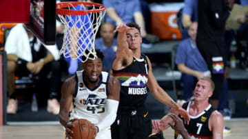 LAKE BUENA VISTA, FLORIDA - AUGUST 19: Donovan Mitchell #45 of the Utah Jazz looks to pass as Michael Porter Jr. #1 of the Denver Nuggets defends during the first half of Game Two of a first round playoff game at AdventHealth Arena at ESPN Wide World Of Sports Complex on August 19, 2020 in Lake Buena Vista, Florida. NOTE TO USER: User expressly acknowledges and agrees that, by downloading and or using this photograph, User is consenting to the terms and conditions of the Getty Images License Agreement. (Photo by Ashley Landis-Pool/Getty Images)