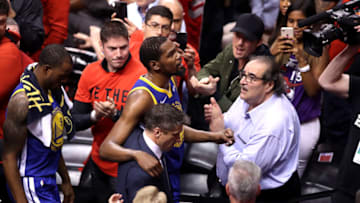 Former OKC Thunder superstar Kevin Durant is assisted off the court after sustaining an injury in the first half of Game Five of the 2019 NBA Finals, (Photo by Claus Andersen/Getty Images)