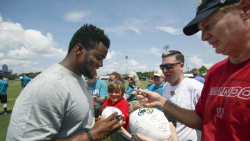 Jul 31, 2015; Jacksonville, FL, USA; Jacksonville Jaguars defensive end Dante Fowler (56) signs autographs during training camp workouts at Florida Blue Health & Wellness Practice Field. Mandatory Credit: Reinhold Matay-USA TODAY Sports