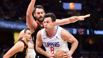 OKC Thunder Team Previews: Danilo Gallinari drives around Kevin Love (Photo by Jason Miller/Getty Images)