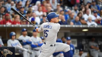 SAN DIEGO, CA - JUNE 30: Austin Barnes #15 of the Los Angeles Dodgers hits a grand slam during the first inning of a baseball game against the San Diego Padres at PETCO Park on June 30, 2017 in San Diego, California. (Photo by Denis Poroy/Getty Images)