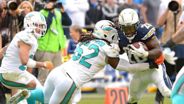 Dec 20, 2015; San Diego, CA, USA; Miami Dolphins middle linebacker Kelvin Sheppard (52) stops San Diego Chargers running back Melvin Gordon (28) after a complete pass in the second half of the game at Qualcomm Stadium. Mandatory Credit: Jayne Kamin-Oncea-USA TODAY Sports